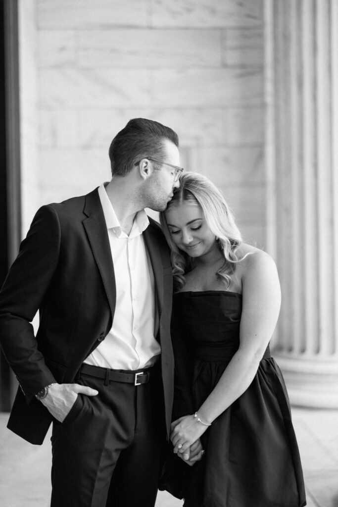 Black and white portrait of couple sharing a quiet moment during their Cleveland engagement session at Cleveland Museum of Art.