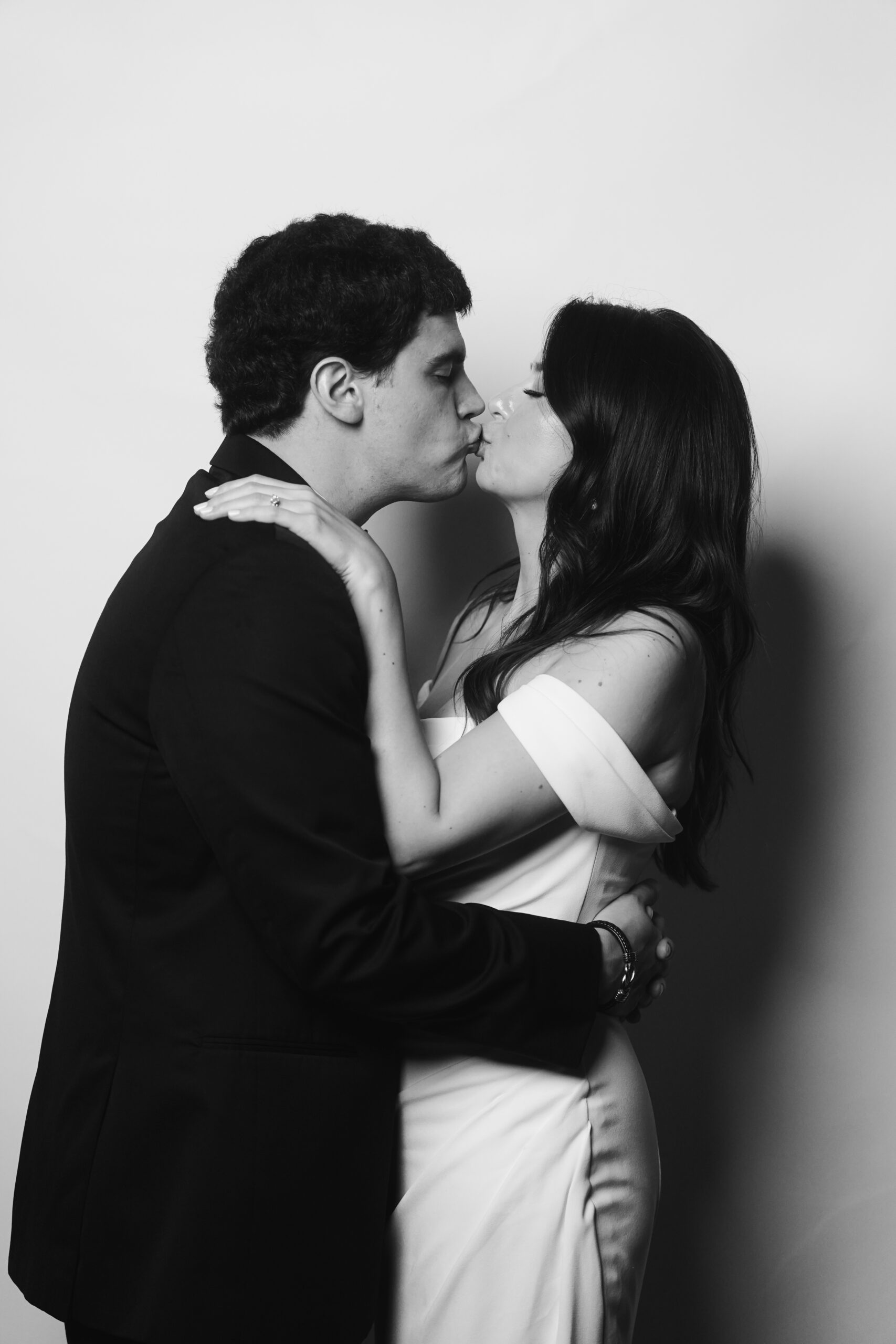 Bride and groom share a kiss during their Portrait Parlour guest experience | Cleveland wedding photographer